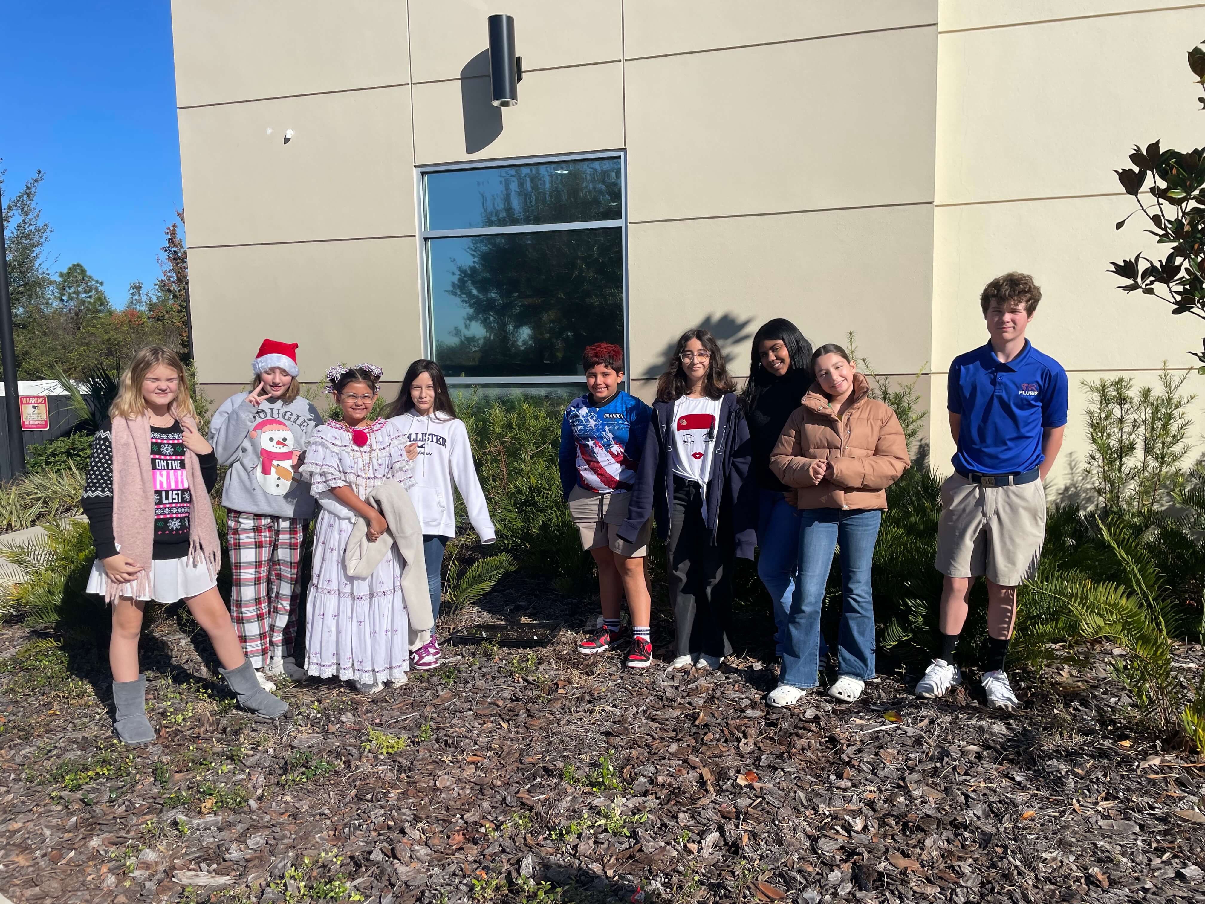 photo of students on playground and teacher reading to students 